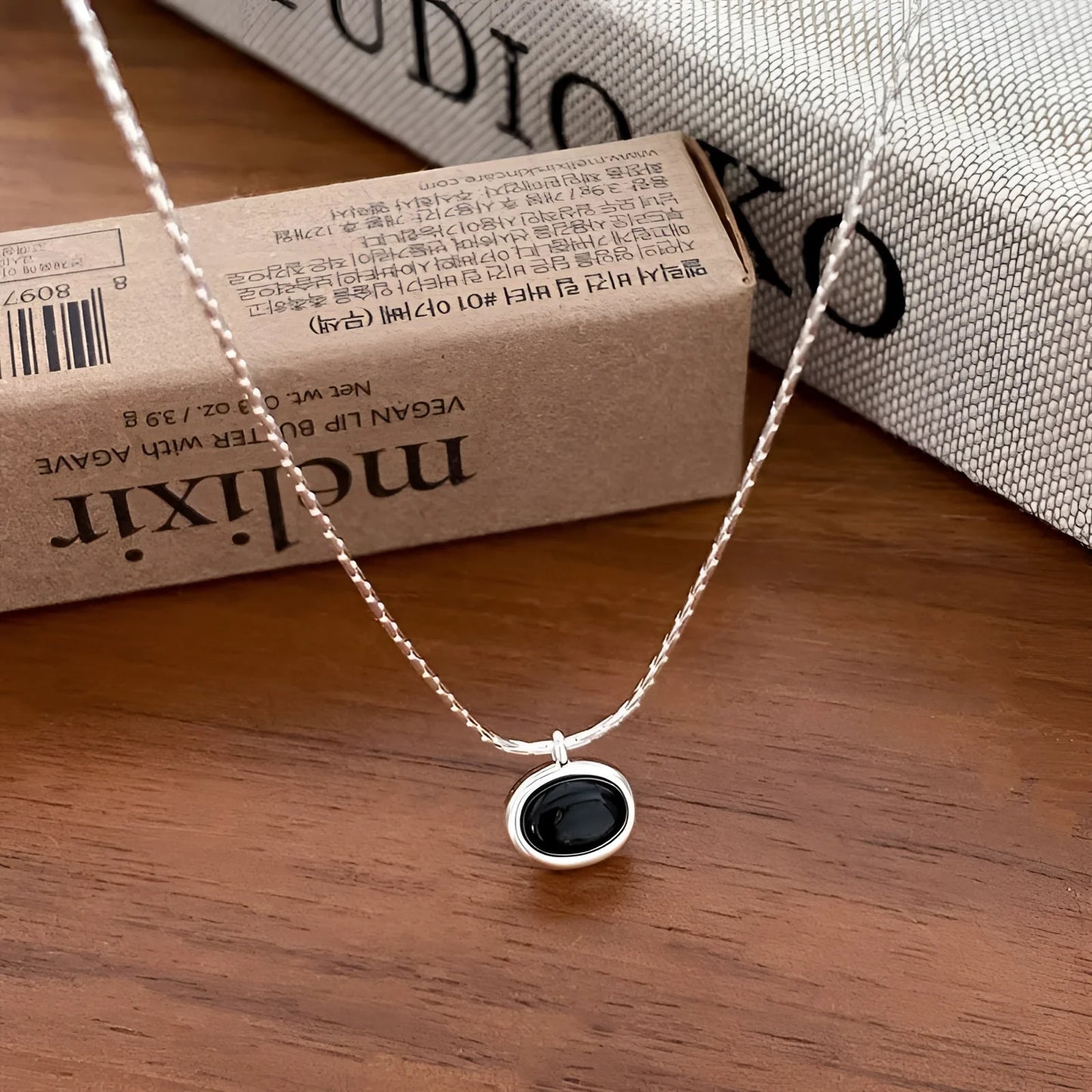 Modern Chic Necklace: Minimalist Silver Chain and Black Stone Pendant
- ModishWorld