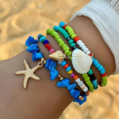 Bohemian Beach Bracelets with Starfish, Seashells, and Gold Evil Eye Charms
 - ModishWorld