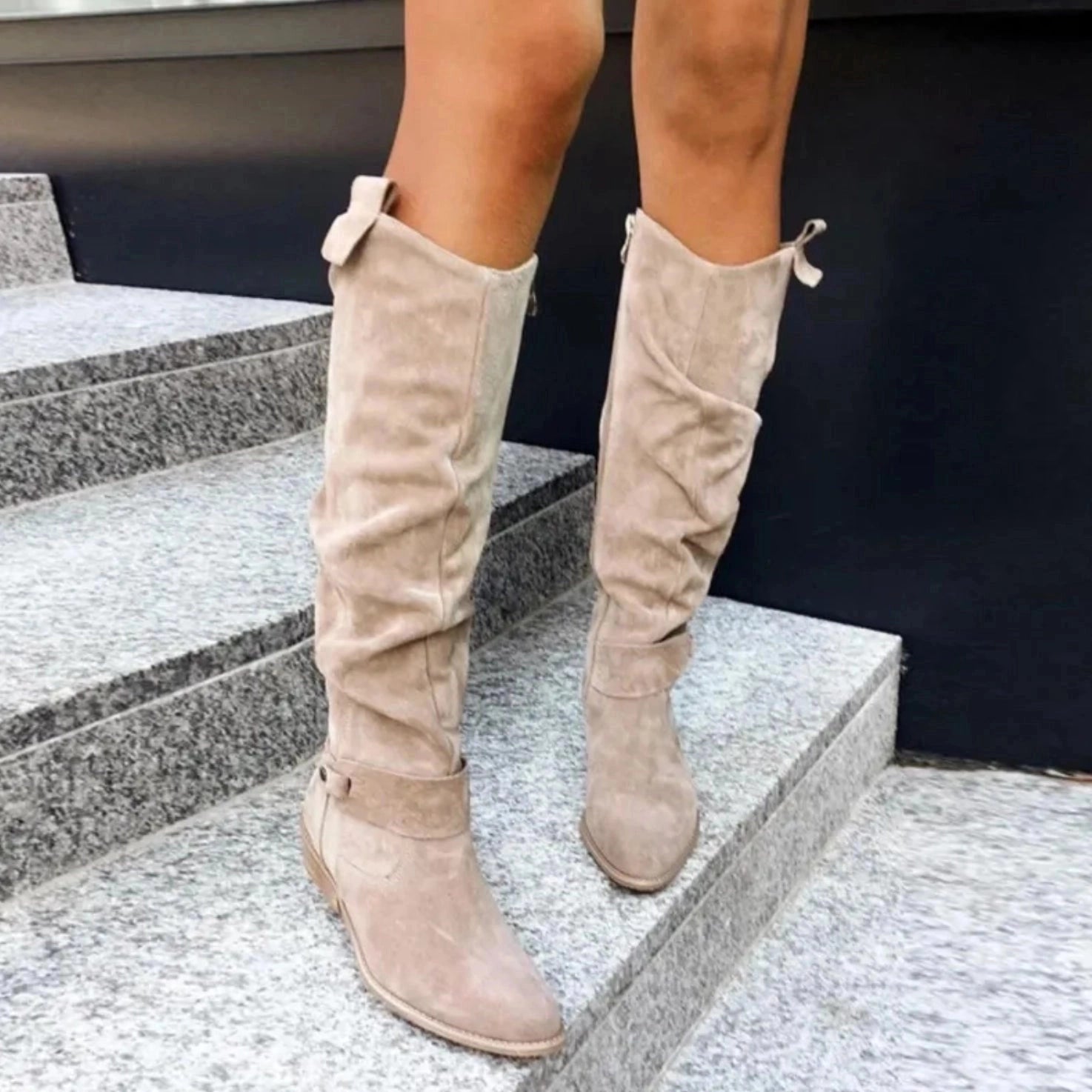 Women's stylish beige suede knee-high boots featuring a bow detail, perfect for winter.
 - ModishWorld