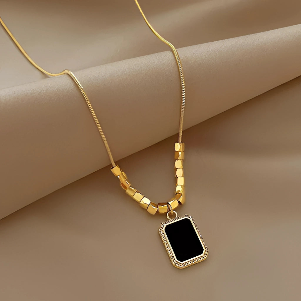 Adjustable Black Pendant Necklace with Gold Snake Chain and Beveled Crystal
 - ModishWorld