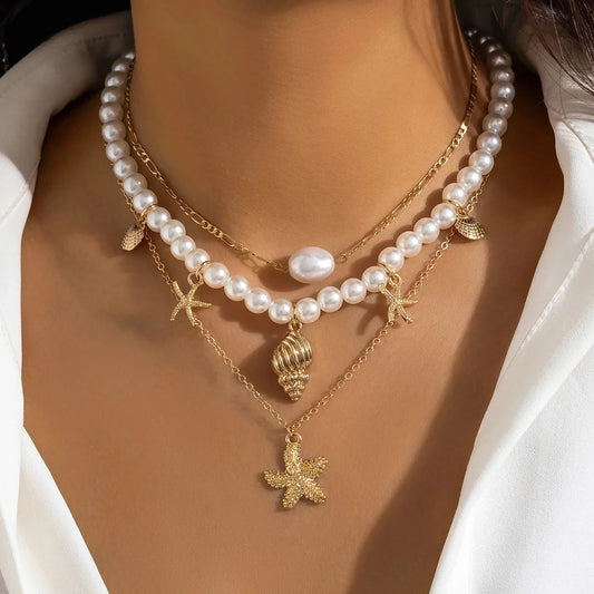 Elegant Beach Necklace: Pearls, Gold Starfish & Seashells
 - ModishWorld