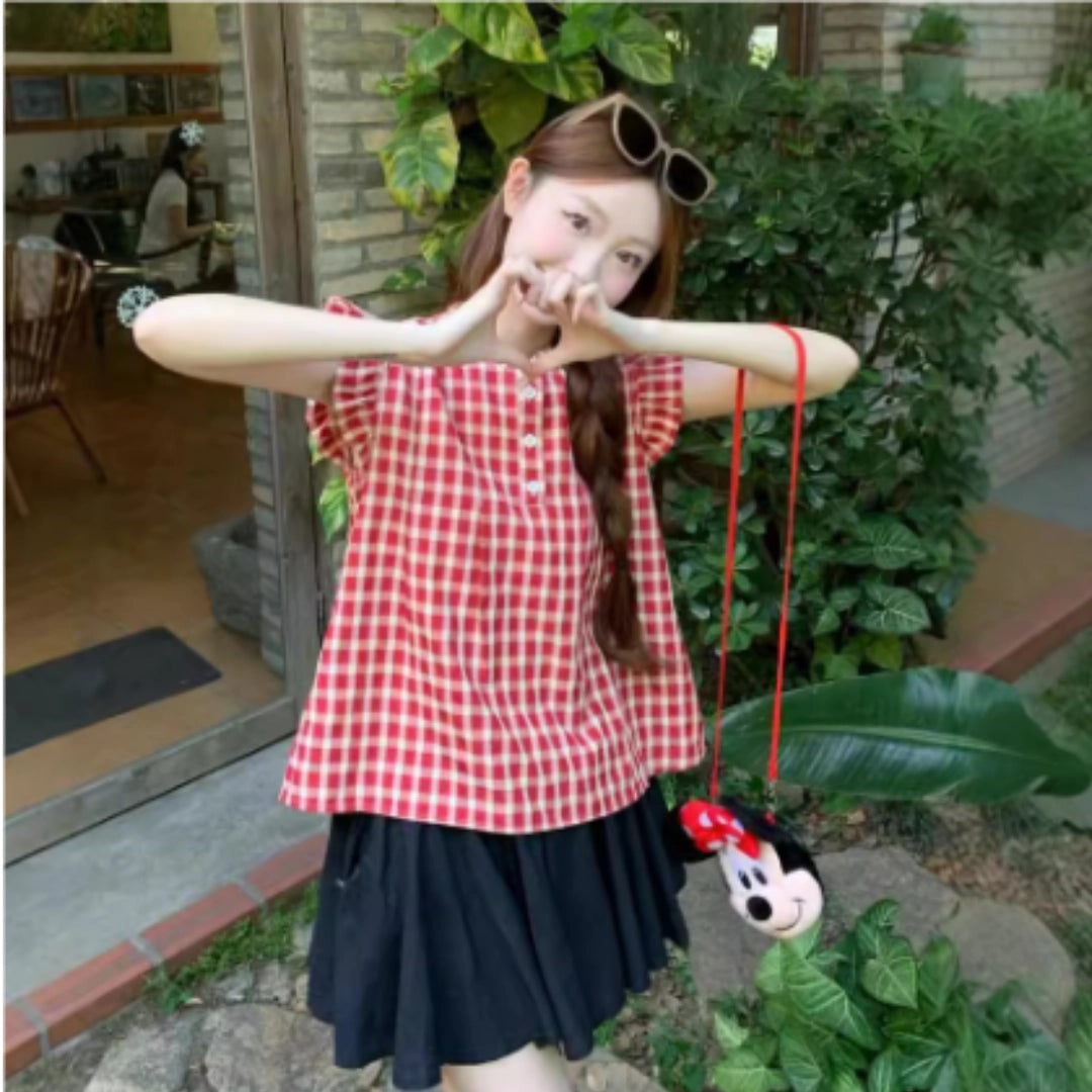 Summer Outfit: Red Gingham Top, Black Pleated Skirt, and Mickey Mouse Purse
 - ModishWorld