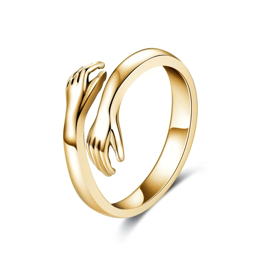 Gold Hand-Hug Rings: Symbolic Couple's Jewelry
 - ModishWorld